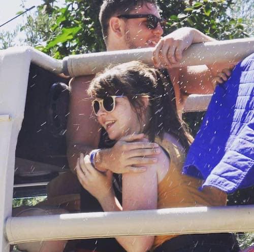 DAYMADE winner, Abbi, smiling in the arms of her boyfriend on a jeep on holiday
